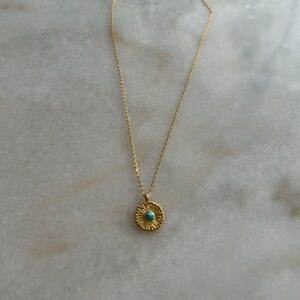 Beautiful necklace with blue stone in the center